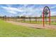 Community playground with swings and a play area perfect for families to enjoy at 8113 Key West Dove St, Winter Garden, FL 34787