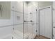 Bright bathroom featuring a glass shower with white subway tile and a built-in seat with a built-in storage niche at 871 Paddington Ter, Lake Mary, FL 32746