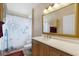 Nautical themed bathroom featuring an ornate framed mirror and pedestal sink at 871 Paddington Ter, Lake Mary, FL 32746