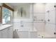 Bright bathroom featuring a soaking tub, glass shower, and stylish tile work at 871 Paddington Ter, Lake Mary, FL 32746