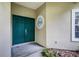Stylish entryway featuring a double door and a round window, offering a unique and inviting entrance to the home at 871 Paddington Ter, Lake Mary, FL 32746
