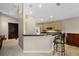 Eat-in kitchen featuring granite counters, breakfast bar, wood cabinets and tile floors at 871 Paddington Ter, Lake Mary, FL 32746