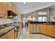 Well-equipped kitchen featuring granite countertops and stainless steel appliances at 871 Paddington Ter, Lake Mary, FL 32746