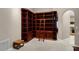 Elegant library with custom built-in bookshelves and a rolling ladder for easy access at 871 Paddington Ter, Lake Mary, FL 32746