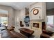 Spacious living room boasts a fireplace, high ceilings, and neutral color palette at 871 Paddington Ter, Lake Mary, FL 32746