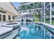 Enclosed pool with spa and outdoor seating area for entertaining guests at 871 Paddington Ter, Lake Mary, FL 32746