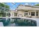 Enclosed swimming pool with spa and an outdoor seating area at 871 Paddington Ter, Lake Mary, FL 32746