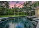 A sparkling screened in pool with a spa, beautiful landscaping and privacy at 871 Paddington Ter, Lake Mary, FL 32746