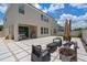 Expansive backyard featuring a patio with seating and shade, ideal for outdoor gatherings at 9025 Horizon Pointe Trl, Windermere, FL 34786