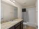 Cozy bathroom with granite counters, a single sink vanity, and a shower with a tub at 9025 Horizon Pointe Trl, Windermere, FL 34786