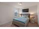 This cozy bedroom features a neutral color palette, stylish decor, and a bright window at 9025 Horizon Pointe Trl, Windermere, FL 34786