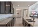Modern kitchen featuring granite countertops, stainless steel appliances, and dark wood cabinets at 9025 Horizon Pointe Trl, Windermere, FL 34786