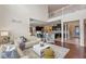 The expansive living room boasts high ceilings, hardwood floors, and modern furnishings, leading to an open kitchen at 9025 Horizon Pointe Trl, Windermere, FL 34786