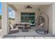 Cozy covered patio with comfortable seating, perfect for relaxing outdoors and enjoying the fresh air at 9025 Horizon Pointe Trl, Windermere, FL 34786