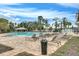Resort-style pool area featuring lounge chairs, a gazebo, and a splash pad, perfect for relaxation and recreation at 9025 Horizon Pointe Trl, Windermere, FL 34786