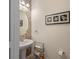Charming powder room with decorative mirror, modern sink, and stylish accent wall at 9025 Horizon Pointe Trl, Windermere, FL 34786