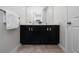 Close up of the bathroom vanity with double sinks and a framed mirror and nice lighting at 9115 Longship Aly, Orlando, FL 32832