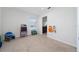 Bright bedroom with a window providing natural light, neutral carpet, and an en-suite bathroom for added convenience at 9115 Longship Aly, Orlando, FL 32832