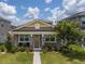 Charming single-story home with a welcoming porch and beautifully landscaped front yard at 9115 Longship Aly, Orlando, FL 32832