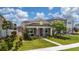 Charming single-story home with a welcoming porch and beautifully landscaped front yard at 9115 Longship Aly, Orlando, FL 32832