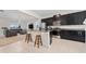 Modern kitchen open to the living room featuring granite countertops, stainless appliances at 9115 Longship Aly, Orlando, FL 32832