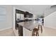 Modern kitchen features granite countertops, stainless steel appliances, and a breakfast bar at 9115 Longship Aly, Orlando, FL 32832