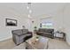 Bright living room showcasing modern decor, neutral carpet and ample natural light at 9115 Longship Aly, Orlando, FL 32832