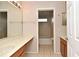 Bathroom vanity with long counter space, next to a shower and bathtub combo at 9223 Leeland Archer Blvd, Orlando, FL 32836
