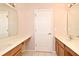 Dual sink bathroom with long counter space and cabinetry for ample storage at 9223 Leeland Archer Blvd, Orlando, FL 32836