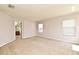 Spacious bedroom with neutral carpet, natural light and an ensuite bathroom at 9223 Leeland Archer Blvd, Orlando, FL 32836