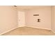 This carpeted bedroom has neutral paint and a wall mount for a television at 9223 Leeland Archer Blvd, Orlando, FL 32836