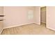 Carpeted bedroom featuring neutral paint, base trim and natural light from a window at 9223 Leeland Archer Blvd, Orlando, FL 32836