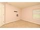 This carpeted bedroom has neutral paint and a wall mount for a television at 9223 Leeland Archer Blvd, Orlando, FL 32836
