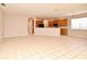 Open kitchen featuring wood cabinets and tile flooring at 9223 Leeland Archer Blvd, Orlando, FL 32836