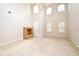 Spacious living room with tile flooring leading to carpeted area and high ceilings at 9223 Leeland Archer Blvd, Orlando, FL 32836