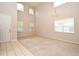 Open-concept living room featuring neutral color palette, high ceilings, and ample windows at 9223 Leeland Archer Blvd, Orlando, FL 32836