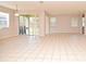 Bright living room with tile floors and sliding glass doors at 9223 Leeland Archer Blvd, Orlando, FL 32836