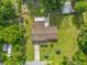 Aerial view of the property highlighting the house, gardens, and surrounding landscape at 1008 Bay Ave, Lake Wales, FL 33859