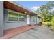 Exterior view with a covered entrance and concrete porch at 1008 Bay Ave, Lake Wales, FL 33859