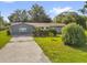 Charming single-story home with well-maintained landscaping and a concrete driveway at 1008 Bay Ave, Lake Wales, FL 33859
