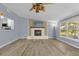 Spacious living room with wood flooring and a brick fireplace at 1008 Bay Ave, Lake Wales, FL 33859