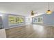 Bright living room featuring wood flooring and large windows at 1008 Bay Ave, Lake Wales, FL 33859