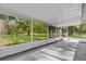 Screened patio with a view of the lush green backyard at 1008 Bay Ave, Lake Wales, FL 33859