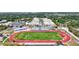 Aerial view of a sports complex with a running track and bleachers at 1039 Eagles Forrest Dr, Apopka, FL 32712