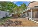 Spacious backyard featuring lush trees, providing a private and serene outdoor space at 1039 Eagles Forrest Dr, Apopka, FL 32712