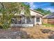 View of backyard and screened patio, perfect for outdoor enjoyment and relaxation at 1039 Eagles Forrest Dr, Apopka, FL 32712
