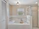 Bright bathroom with soaking tub and walk-in shower at 1039 Eagles Forrest Dr, Apopka, FL 32712