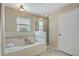 Bathroom with bathtub and shower at 1039 Eagles Forrest Dr, Apopka, FL 32712