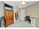 Cozy bedroom featuring a closet, desk, and built-in storage, illuminated by a ceiling fan at 1039 Eagles Forrest Dr, Apopka, FL 32712