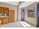 Cozy breakfast nook featuring natural light, light wood cabinets and a large window overlooking the backyard at 1039 Eagles Forrest Dr, Apopka, FL 32712